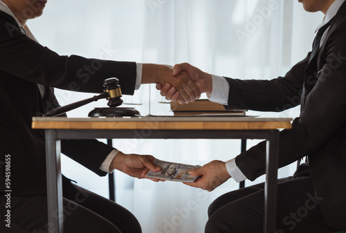 business people shaking hands and Give an under-the-table bribe to an attorney to help a lawyer win a court case. Bribery and Kickback Ideas Fraud and Fraud photo