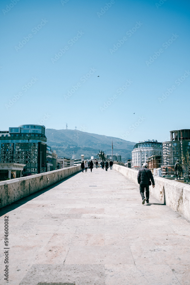 people walking on the bridge