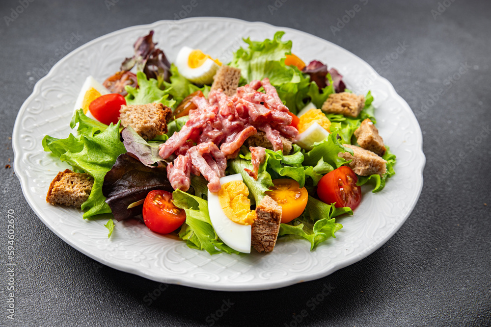 meat salad, bacon, egg, crouton, lettuce, salad dressing vinaigrette Vosges salad Lorraine cuisine meal food snack on the table copy space food background rustic top view meat salad, bacon, egg, crouton, lettuce, salad dressing vinaigrette Vosges salad Lorraine cuisine meal food snack on the table copy space food background rustic top view