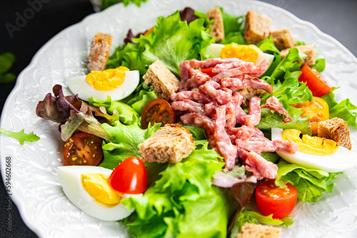 meat salad, bacon, egg, crouton, lettuce, salad dressing vinaigrette Vosges salad Lorraine cuisine meal food snack on the table copy space food background rustic top view