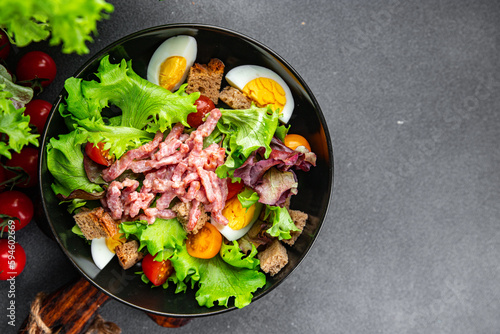 meat salad, bacon, egg, crouton, lettuce, salad dressing vinaigrette  Vosges salad Lorraine cuisine  meal food snack on the table copy space food background rustic top view