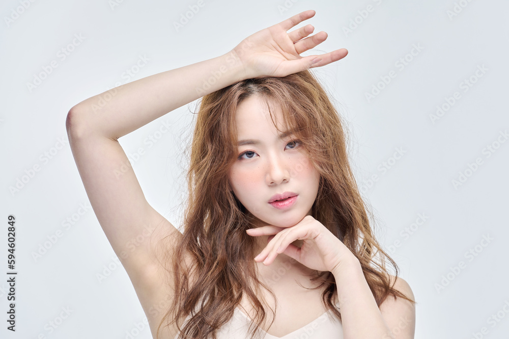 Beautiful Young Asian woman with clean fresh skin touching two hands on face in beauty pose. Pretty girl smiling in white background. Facial treatment, cosmetology, cosmetic surgery, make up concept. Beautiful Young Asian woman with clean fresh skin touching two hands on face in beauty pose. Pretty girl smiling in white background. Facial treatment, cosmetology, cosmetic surgery, make up concept.