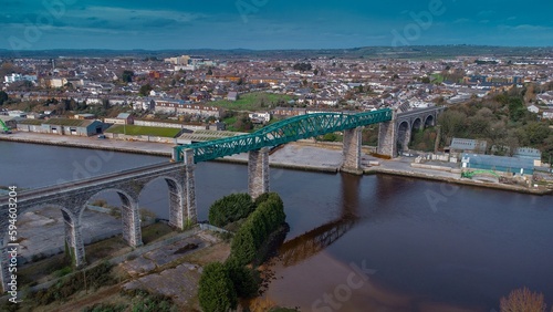 Amazing Boyne viaduct in drogheda spanning over river Boyne in early evening hours. Beautiful pucture of a green metal viaduct and stone arches.