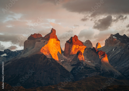 Torres Del Paine National Park, Chile. Patagonia. Mountains Cuernos, Sunrise at the Pehoe lake. Bright gold colors