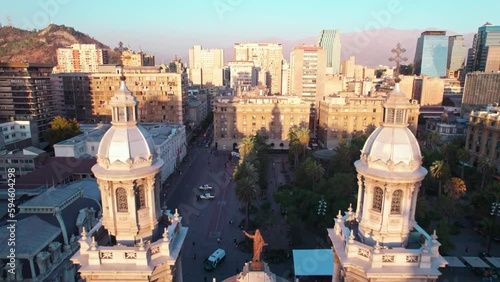 Slow aerial dolly overhead Santiago Metropolitan Cathedral and Plaza de Armas photo