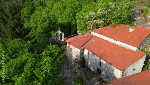 Monastery of san pedro of rocas, esgos, ourense, spain, aerial reverse dolly photo