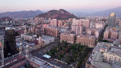 Aerial dolly towards the Plaza de Armas with the San Cristobal Hill with the Costanera tower photo