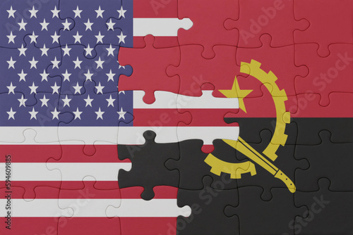 Fotografie puzzle with the national flag of angola and united states of america