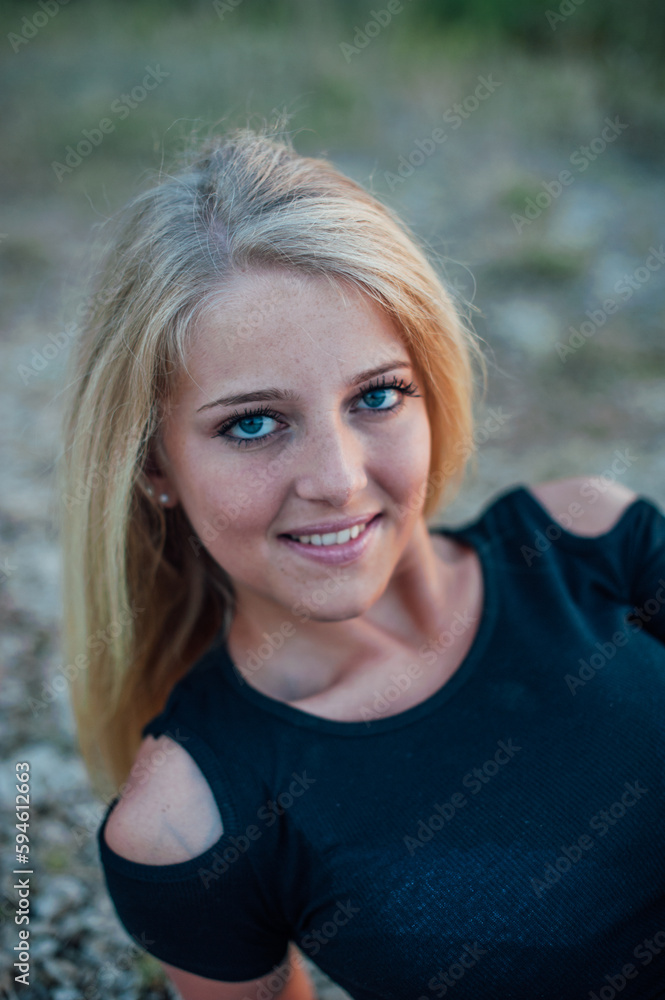 portrait of a blonde woman with blue eyes portrait of a blonde woman with blue eyes