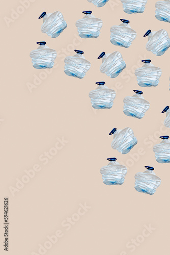 smashed plastic bottles on a beige background photo