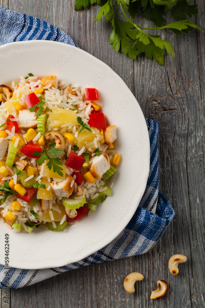 Salad with rice, chicken, peanuts and vegetables. Top view. Salad with rice, chicken, peanuts and vegetables. Top view.