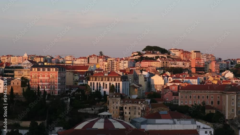 View of Lisbon from Miradouro de Sao Pedro de Alcantara viewpoint on sunset. Lisbon, Portugal. Camera pan View of Lisbon from Miradouro de Sao Pedro de Alcantara viewpoint on sunset. Lisbon, Portugal. Camera pan