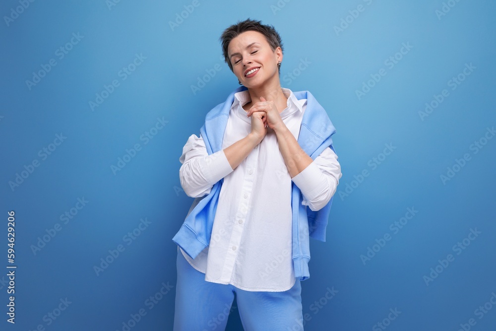 cheerful young woman with short haircut in stylish casual look cheerful young woman with short haircut in stylish casual look