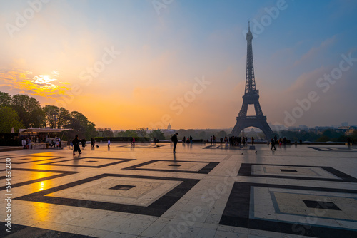 Eiffel Tower  French  Tour Eiffel  silhouette at dawn. View from Trocadero Square with geometrical marble pavement. Paris  France