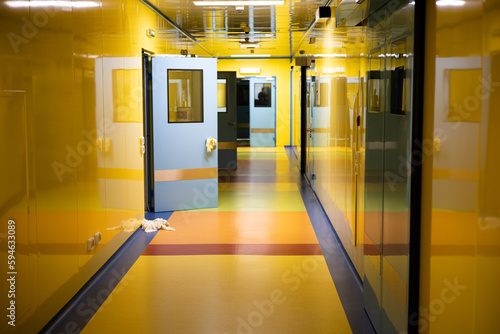 long yellow empty corridor in interior of entrance hall of modern apartments  office or clinic.
