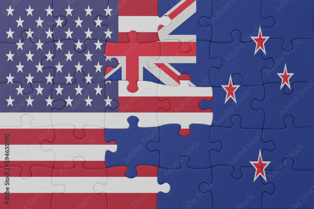 Obraz premium puzzle with the national flag of new zealand and united states of america. macro