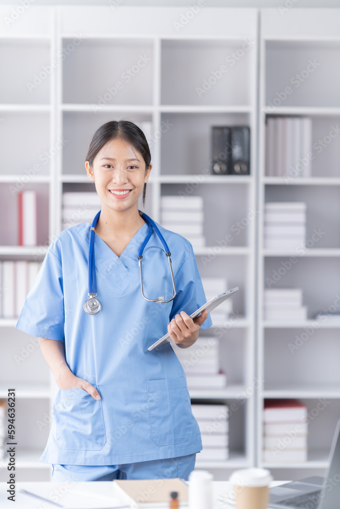 Medical concept of Asian beautiful female, doctor in blue coat with stethoscope, waist up. Medical student. Woman hospital worker looking at camera and smiling, studio, Medical concept of Asian beautiful female, doctor in blue coat with stethoscope, waist up. Medical student. Woman hospital worker looking at camera and smiling, studio,