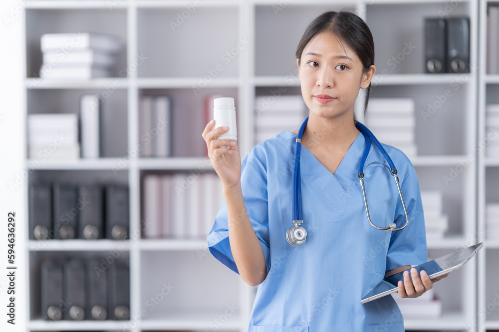 Medical concept of Asian beautiful female, doctor in blue coat with stethoscope, waist up. Medical student. Woman hospital worker looking at camera and smiling, studio, Medical concept of Asian beautiful female, doctor in blue coat with stethoscope, waist up. Medical student. Woman hospital worker looking at camera and smiling, studio,