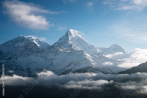 sunrise light over Annapurna mountain range with beautiful clouds, view from Poon hill in Himalayas, Nepal © Mathias