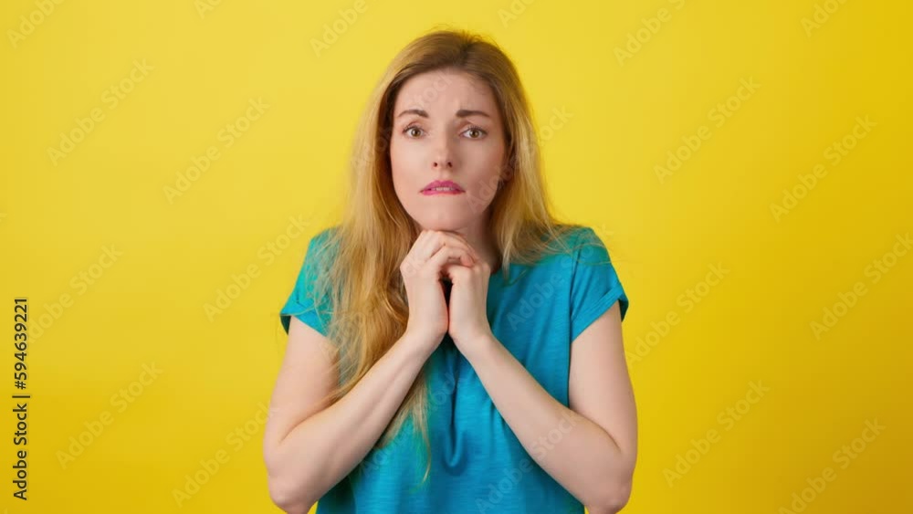 Sadness, anger and worried woman with excitement emotion. Displeased sad lady female screaming, closed eyes and cover ears in studio isolated on yellow background. Sadness, anger and worried woman with excitement emotion. Displeased sad lady female screaming, closed eyes and cover ears in studio isolated on yellow background.