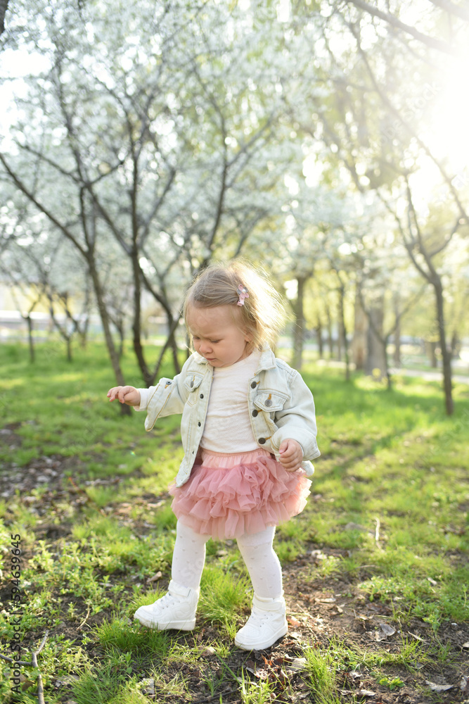 portrait of a cute little girl in spring meadow on green grass portrait of a cute little girl in spring meadow on green grass