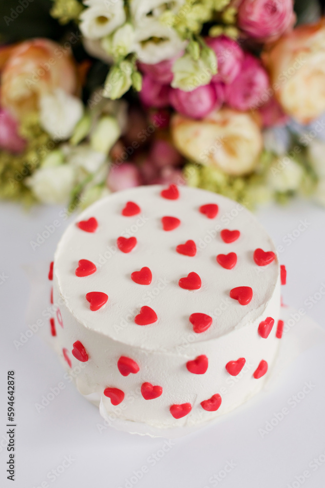 Cake with red hearts and bouquet Cake with red hearts and bouquet