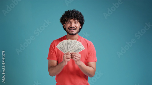 Φωτογραφία Smiling cheerful happy young bearded Indian man 20s years old wears coral shirt