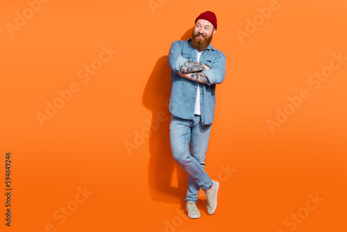 Full size photo of positive youth guy with crossed arms look ads advertise boutique bargains isolated on bright color background © deagreez
