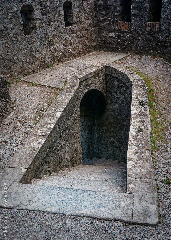 Stone staircase descending under the ramparts of Sisteron Citadel, France