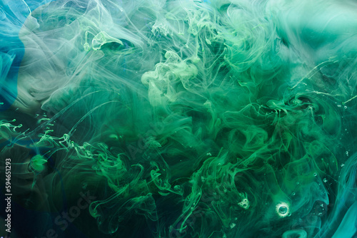 Green contrast liquid art background. Paint ink explosion, abstract clouds of smoke mock-up, watercolor underwater