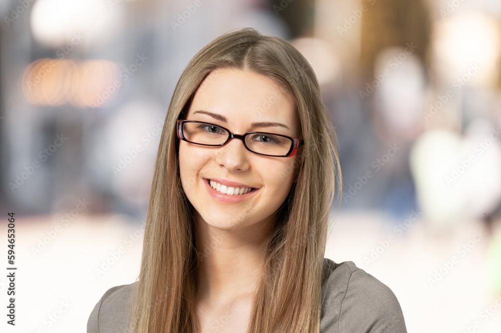 Portrait of young  woman posing on blur background