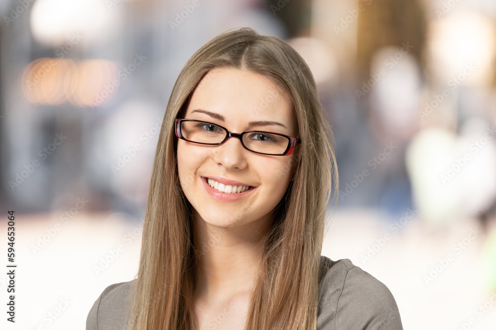 Portrait of young woman posing on blur background Portrait of young woman posing on blur background