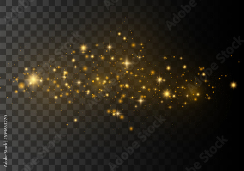 Gold glittering star dust trail of sparkling particles on a transparent background. Bokeh light lights effect background.