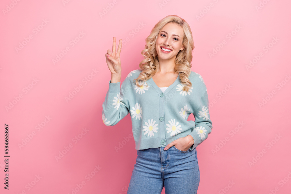 Portrait of satisfied glad young person toothy smile hand fingers demonstrate v-sign isolated on pink color background Portrait of satisfied glad young person toothy smile hand fingers demonstrate v-sign isolated on pink color background