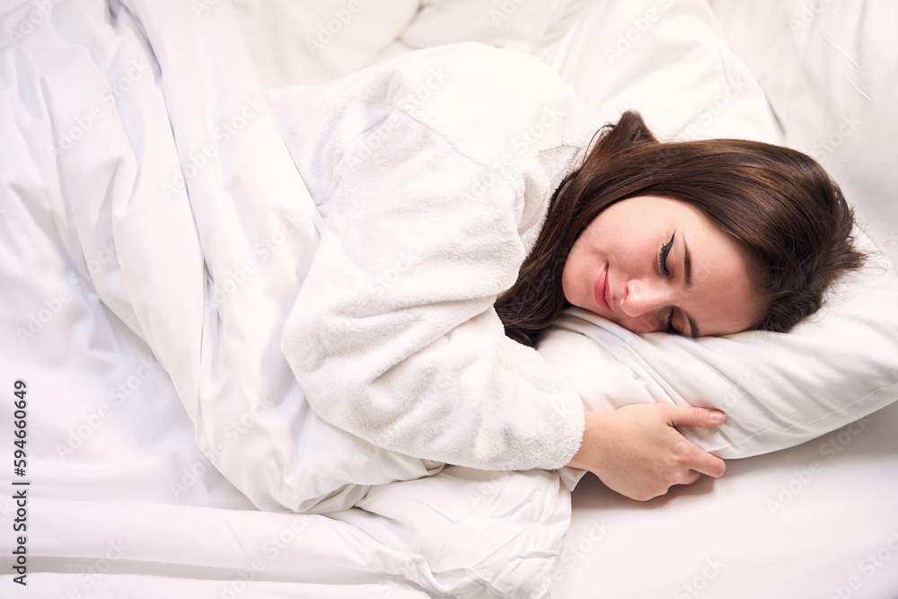 Charming young female sleeps sweetly on a soft pillow, Charming young female sleeps sweetly on a soft pillow,