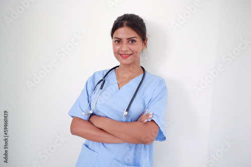 Asian female doctor standing and smiling.