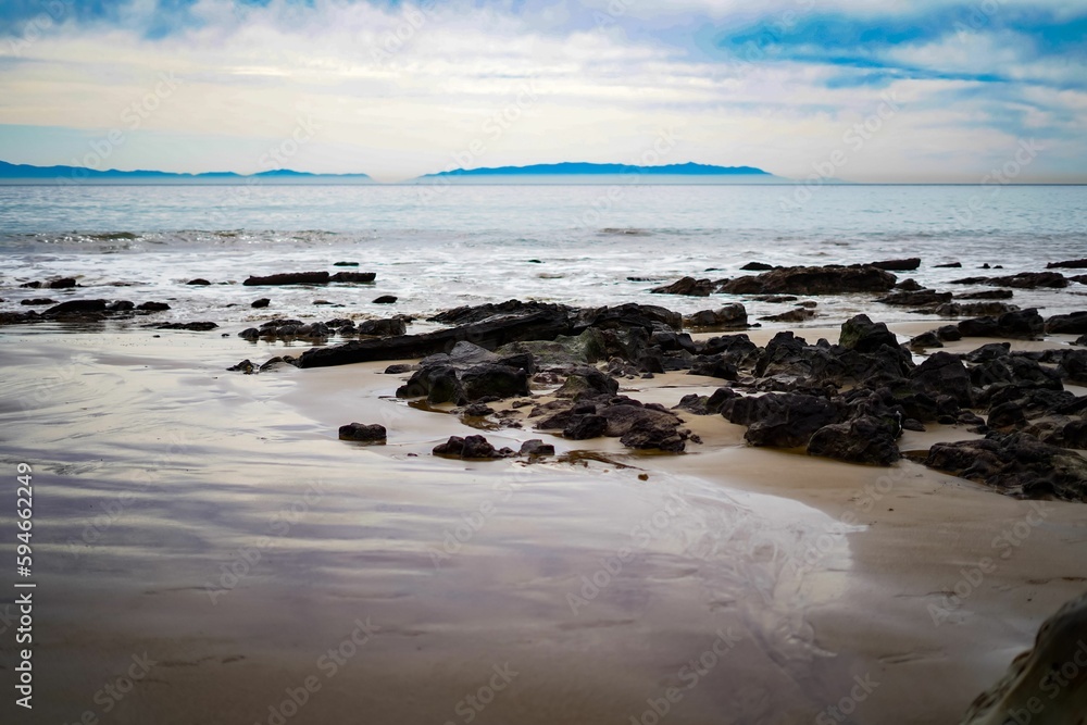 Landscape of a rocky shore of the sea on a gloomy rainy day Landscape of a rocky shore of the sea on a gloomy rainy day