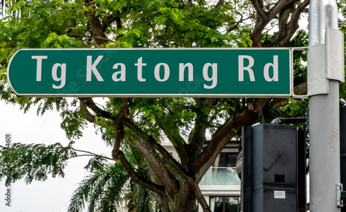 Photography Green road sign in downtown Singapore