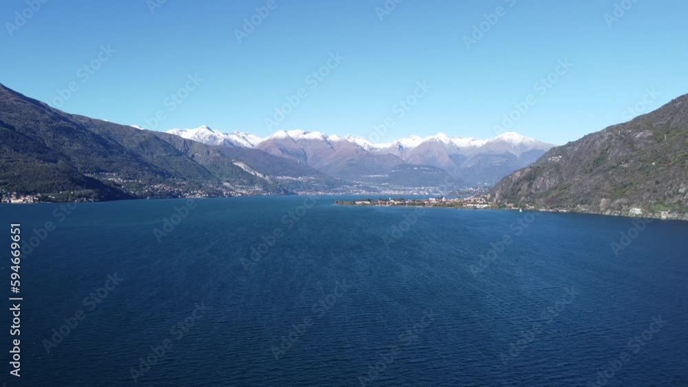 Aerial view of the lake of Como village old town with blue sky and mountains in Bellagio, Italy Aerial view of the lake of Como village old town with blue sky and mountains in Bellagio, Italy