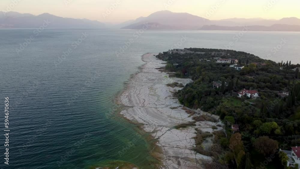 Drone view over a rough rocky lake coast in Bellagio, Italy Drone view over a rough rocky lake coast in Bellagio, Italy