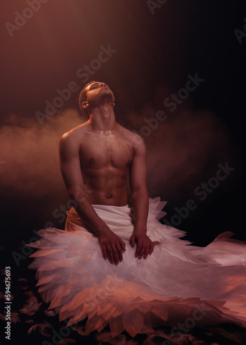 Young strong angel with white wings from heaven. Angel with muscular body. Sensual man