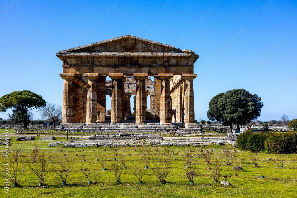Ancient Greek Hera Temple in Paestum, Italy under the clear blue sky