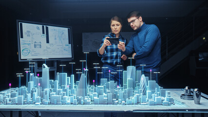 Architect and Engineer have Discussion, Use Augmented Reality Smartphone to Design Sustainable 3D Megalopolis Model. Futuristic Office with Architectural Designers. Graphical VFX on Image.