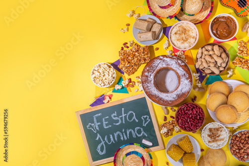 Traditional Festa Junina Summer Festival Carnival Food. Traditional Brazilian Festa Junina dishes and snacks - popcorn  peanuts  corn cake and cookie  pacoca  with holiday decorations and accessories