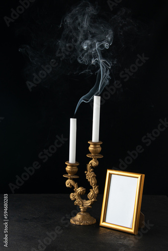 front view of fireless candles with picture frame as memory on dark background israel funeral photo