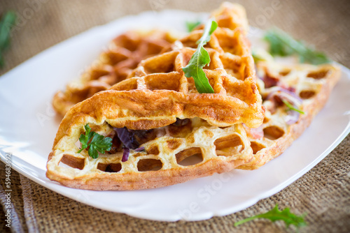 Egg omelette stuffed with onions and herbs, fried in the form of waffles