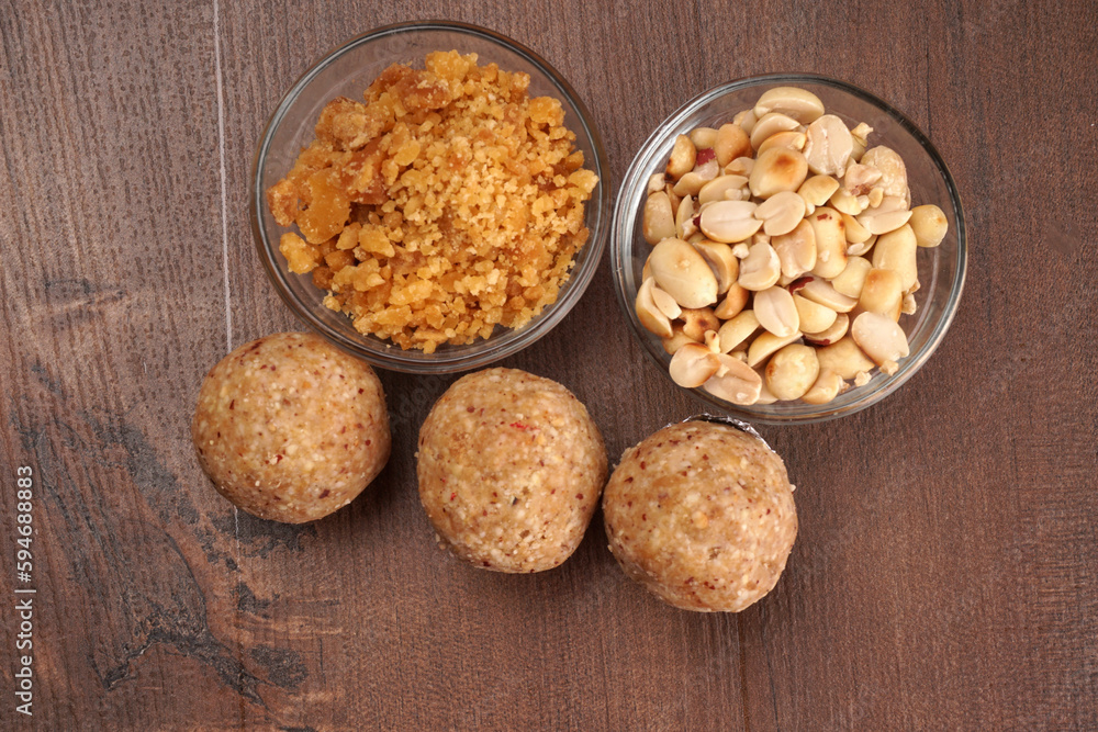 Homemade healthy and sweet groundnut or peanut and Jaggery Laddoo, delicious indian sweet served on a wooden background.Roasted peanut isolated. Homemade healthy and sweet groundnut or peanut and Jaggery Laddoo, delicious indian sweet served on a wooden background.Roasted peanut isolated.