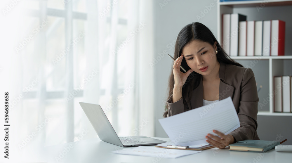 copy space , panorama , banner ,tired business woman sleepy and bored from sitting at a desk for a long time and has office syndrome copy space , panorama , banner ,tired business woman sleepy and bored from sitting at a desk for a long time and has office syndrome