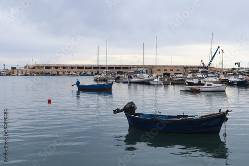 Fishing boats in old harbor of Bari, Puglia, Italy.