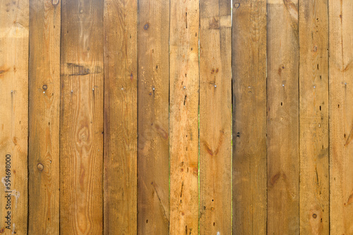 brown wooden fence made of boards  street fencing